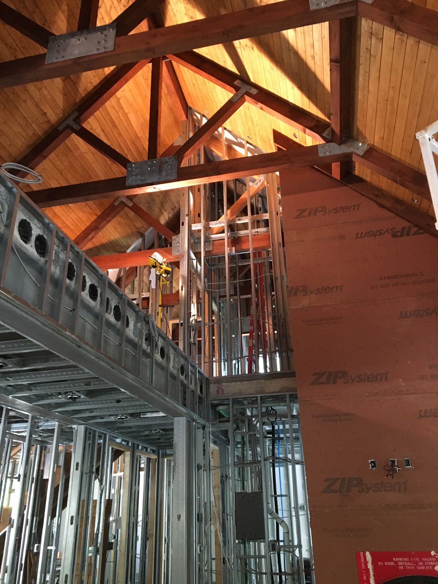 Tall interior framing with exposed timber beams